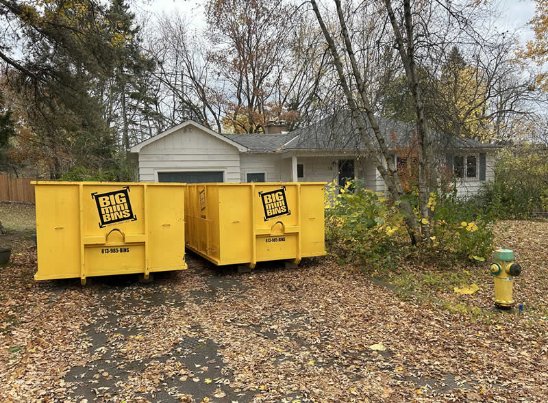 Kingston Ontario dumpster rentals Two dumpster rentals on front lawn of white house